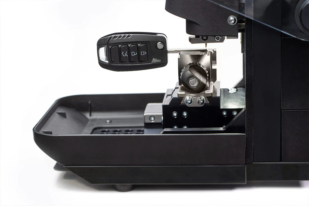 Messenger key cutting machine with key fob.
