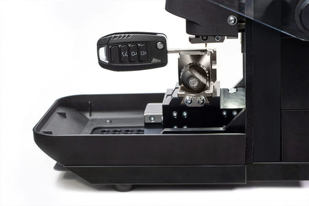 Messenger key cutting machine with key fob.
